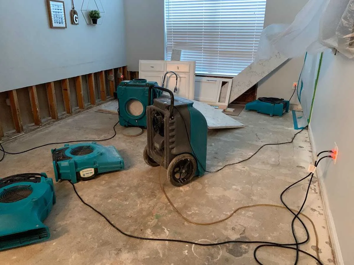 Dehumidifier in flood-cut room for Water Damage Restoration in Guilford
